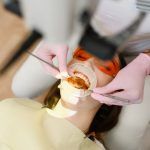 female-dentist-patient-with-opened-mouth-clinic-top-view-stomatology-min